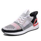 White, black, and red sneaker on a white background