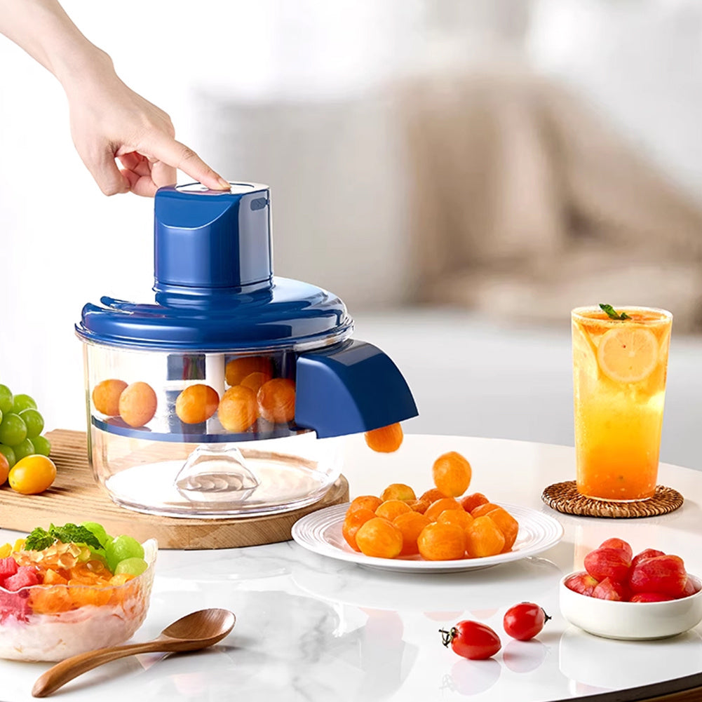 Fruit peeler with oranges, a glass of juice, and fruits on a table.