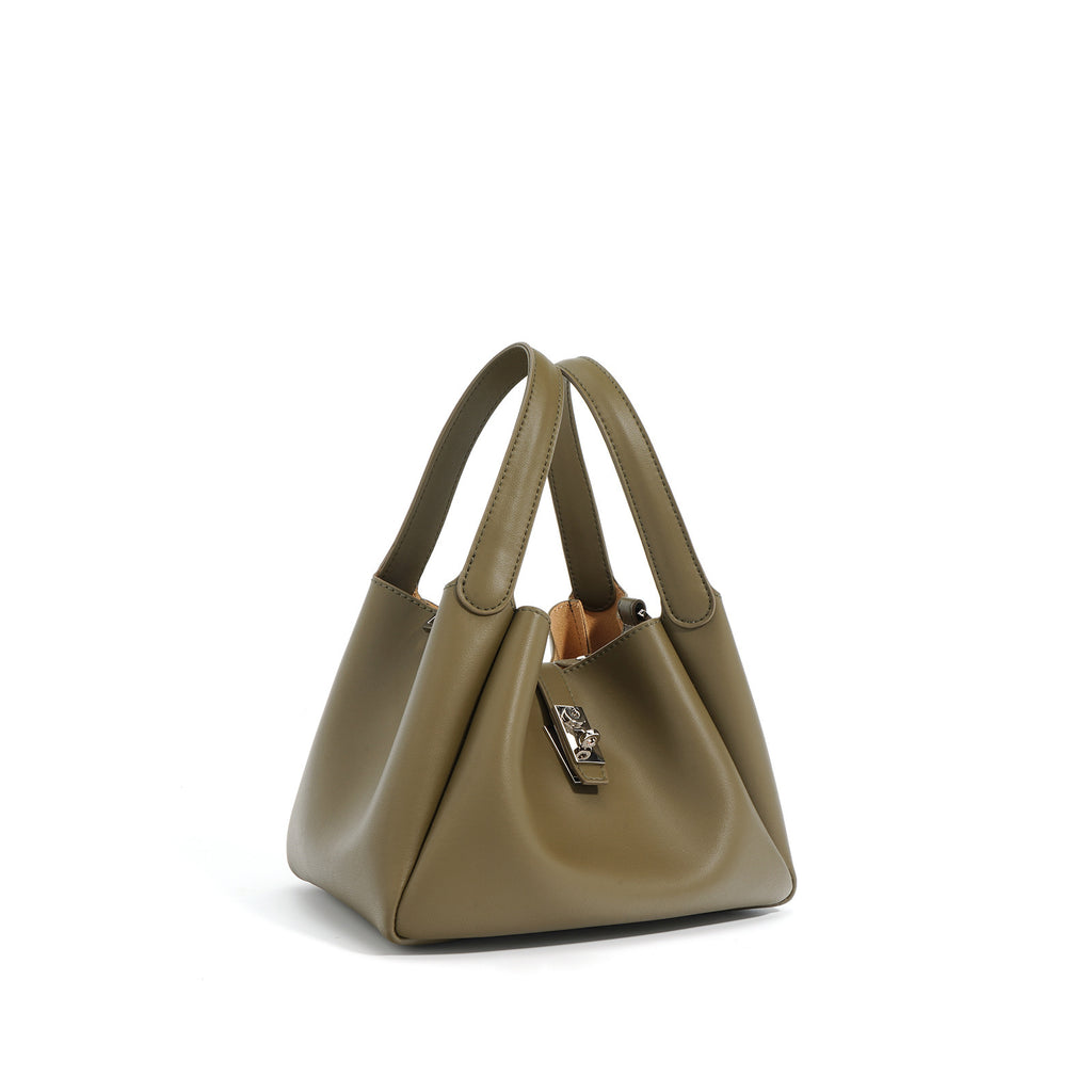 Green handbag on a white background