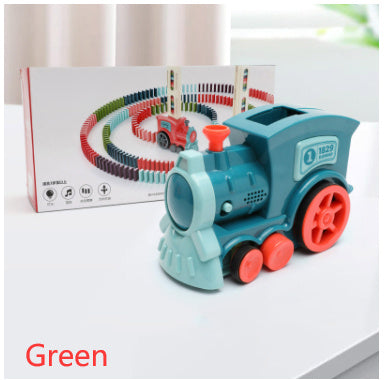 Toy train with green engine and red wheels on a white surface, with packaging in the background.