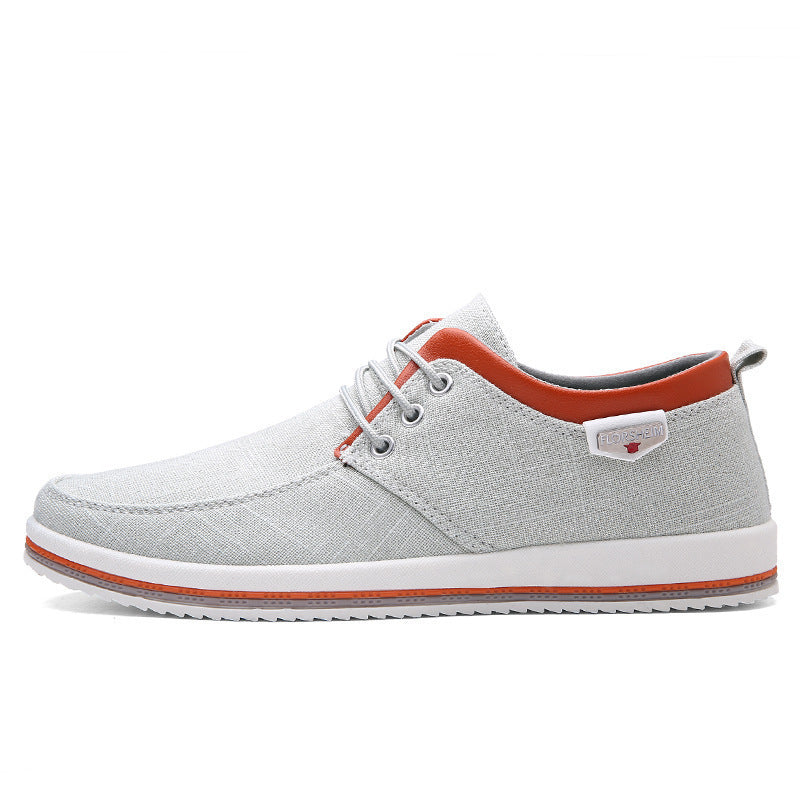 Gray casual shoe with orange accents on a white background