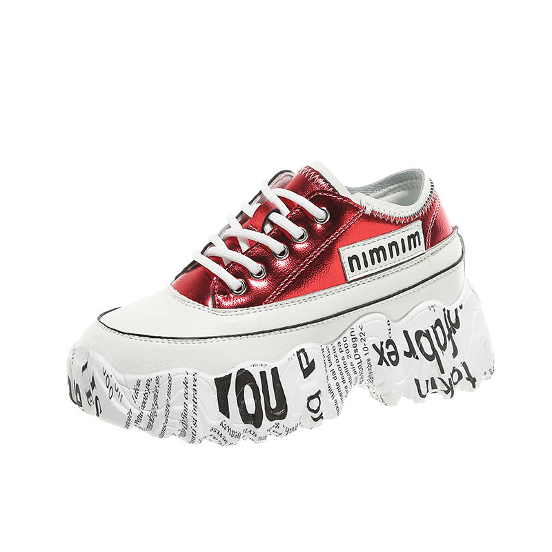 Red and white sneaker with a platform sole on a white background