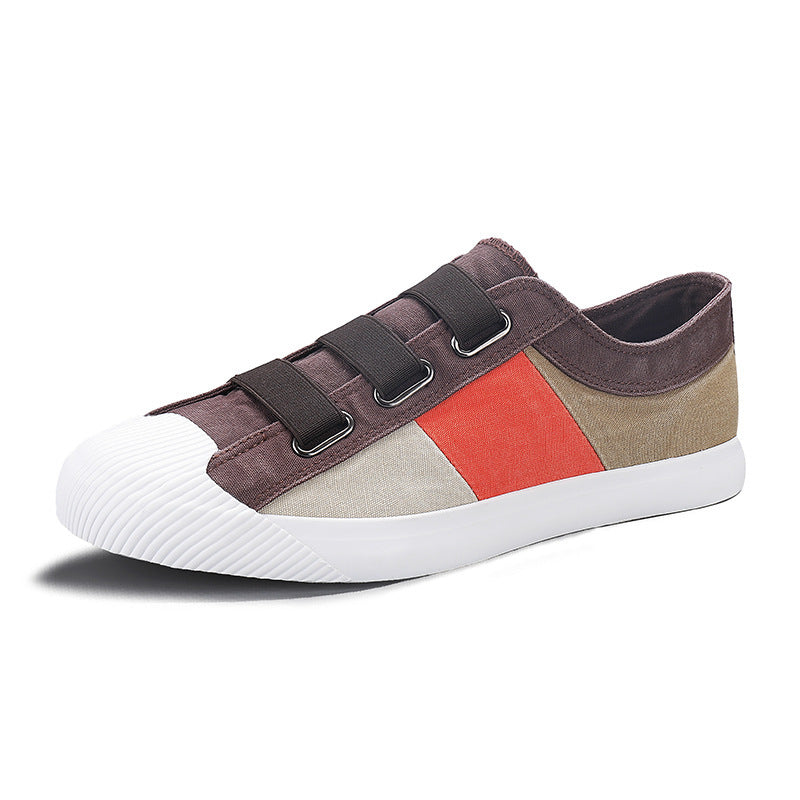 Multicolored sneaker with white sole on a white background