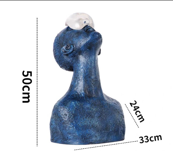 Blue decorative sculpture with measurements on a white background