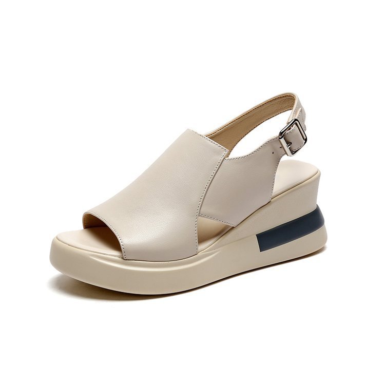 Beige wedge sandal with a blue stripe on a white background