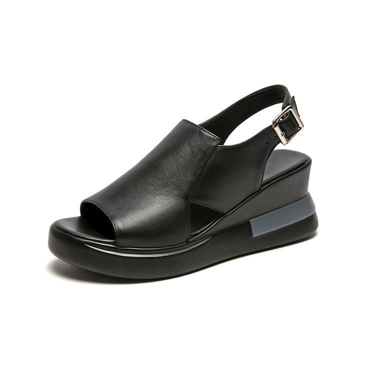 Black sandal with a wedge heel on a white background