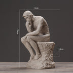 Statue of a thinker with dimensions labeled on a dark background