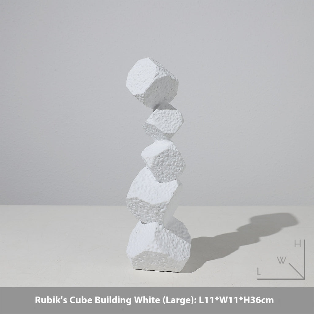 White Rubik's Cube Building sculpture on a light gray background