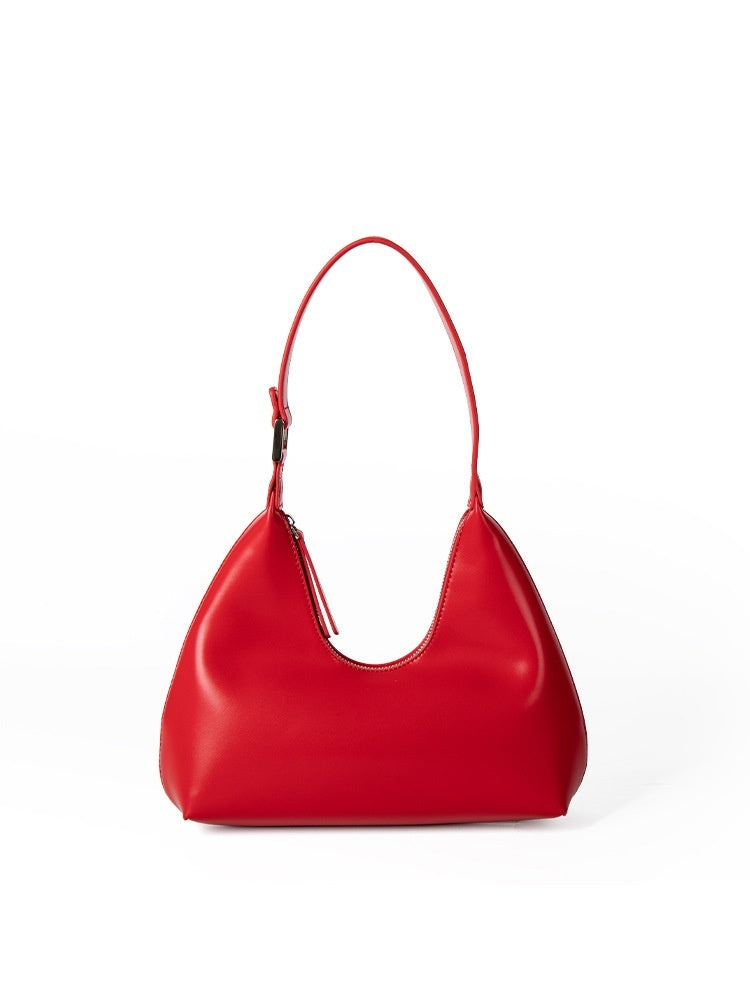 Red handbag on a white background