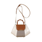 Multicolored handbag with brown, white, and gray sections on a white background