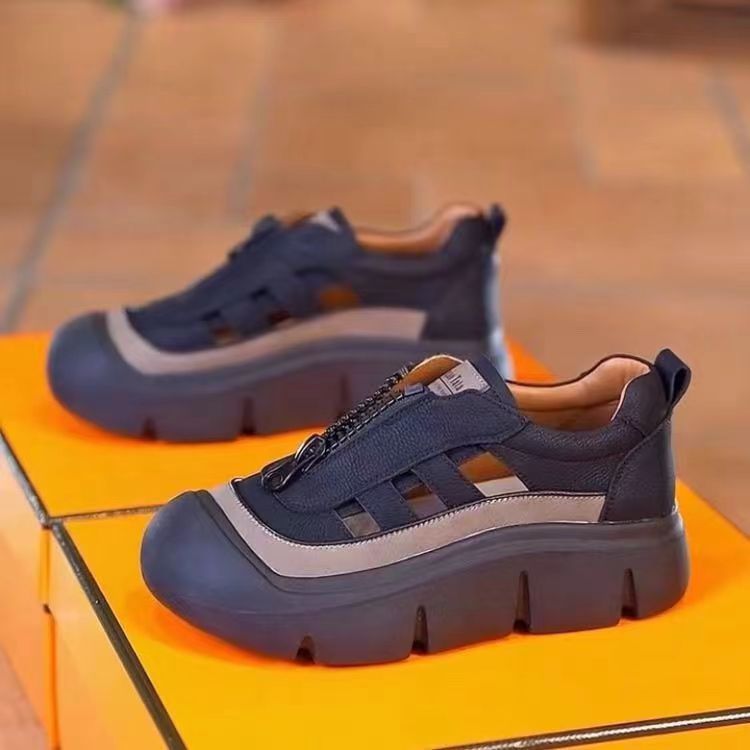 Blue and gray sneakers on a yellow box with a blurred background