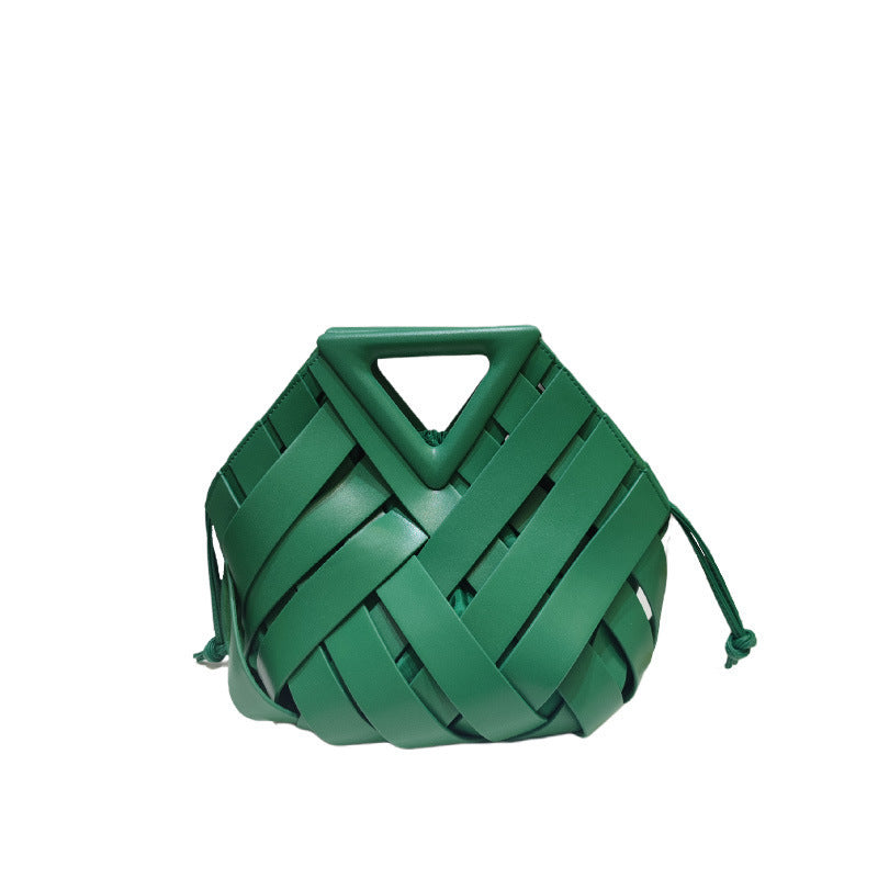 Green woven handbag with a triangular handle on a white background