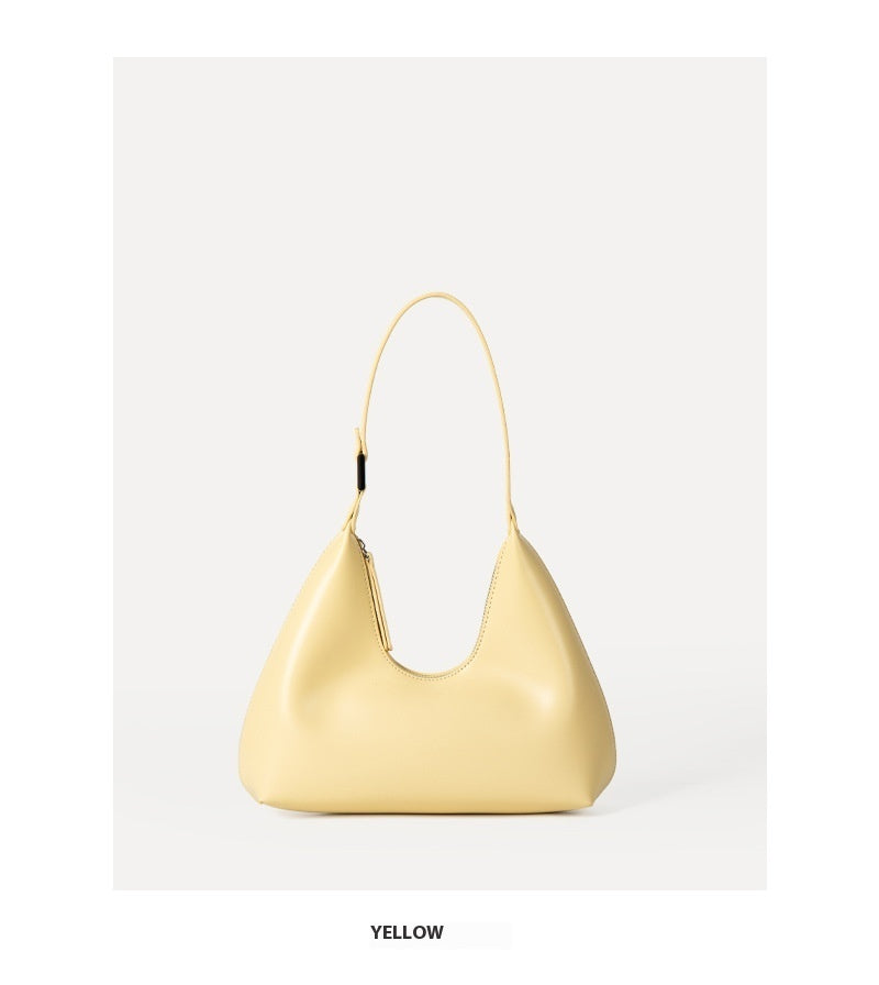 Yellow handbag on a light gray background