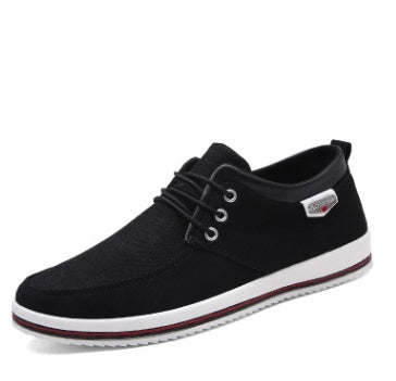 Black casual shoe with white sole on a white background