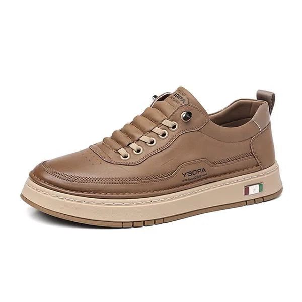 Brown sneaker with brand logo on a white background