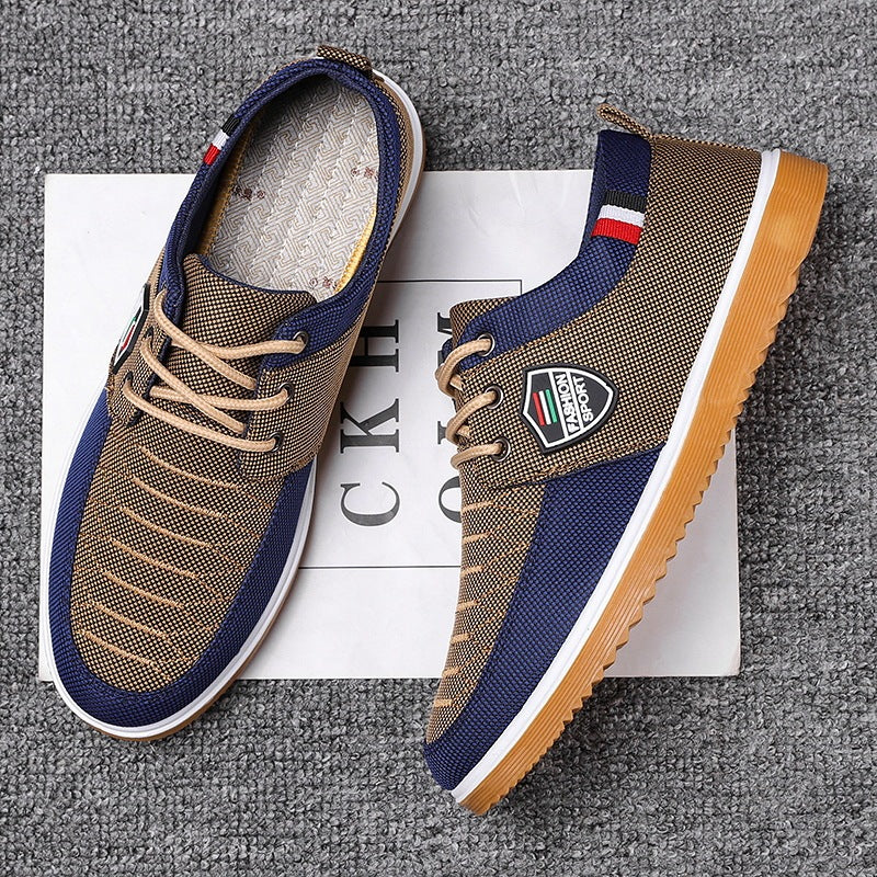 Brown and blue sneakers with a brand logo on a gray textured background