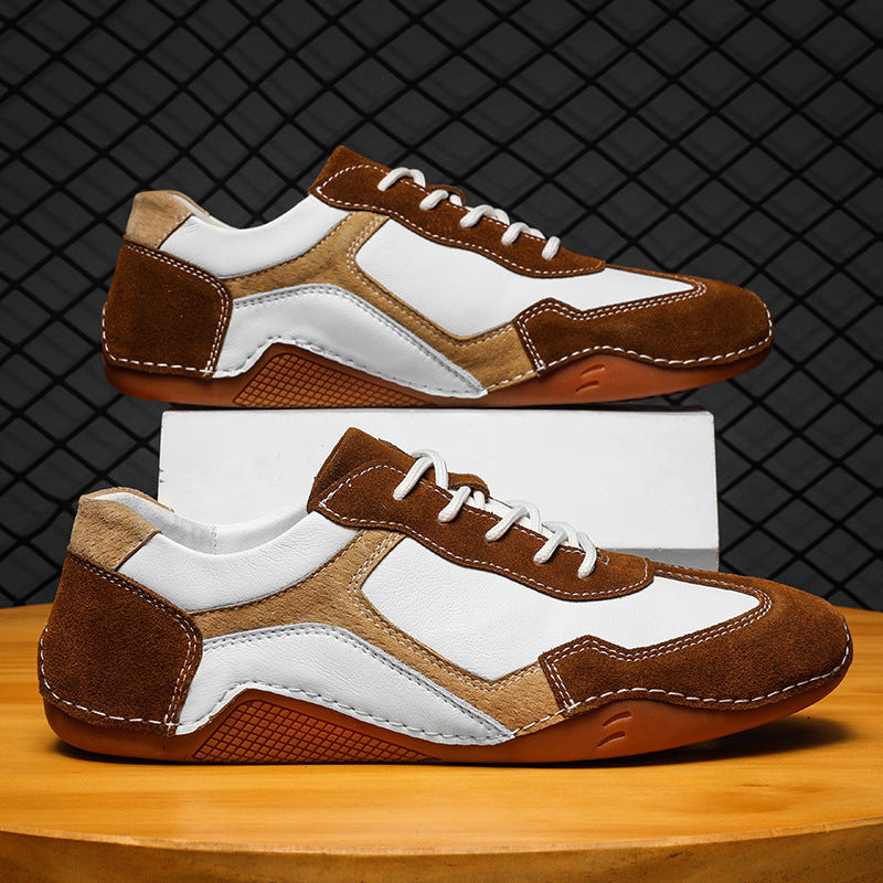 Brown and white sneakers on a wooden surface with a dark textured background