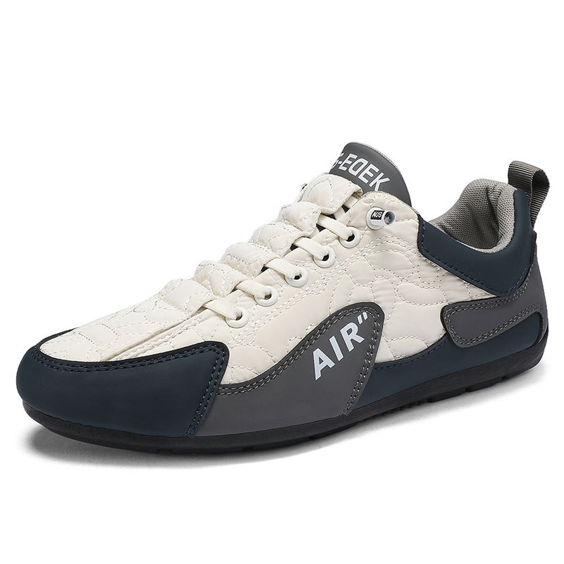 White and navy sneaker with 'Air' branding on a white background
