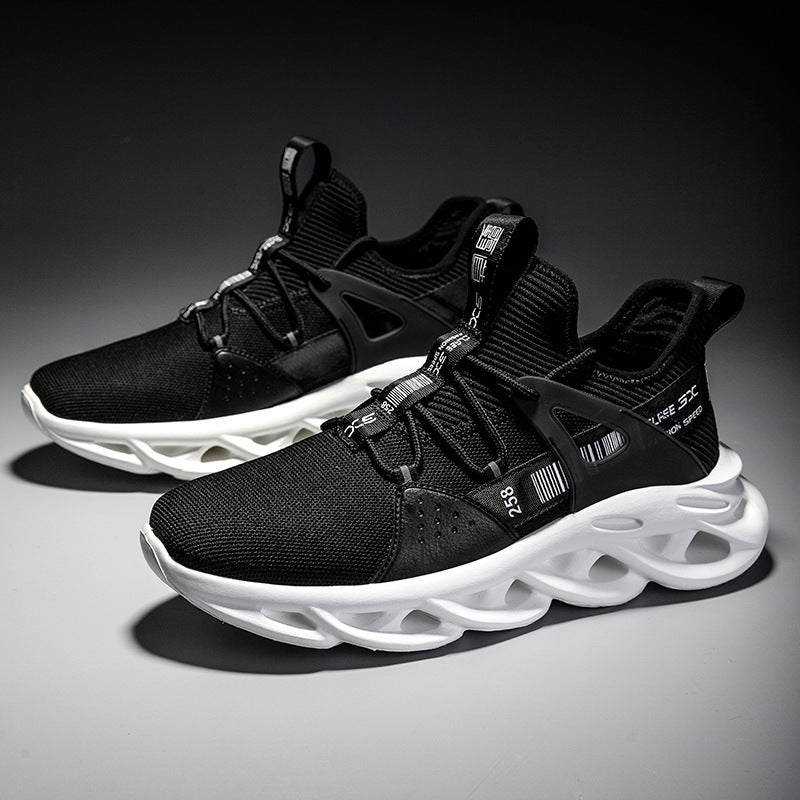 Black athletic shoes with white soles on a dark background