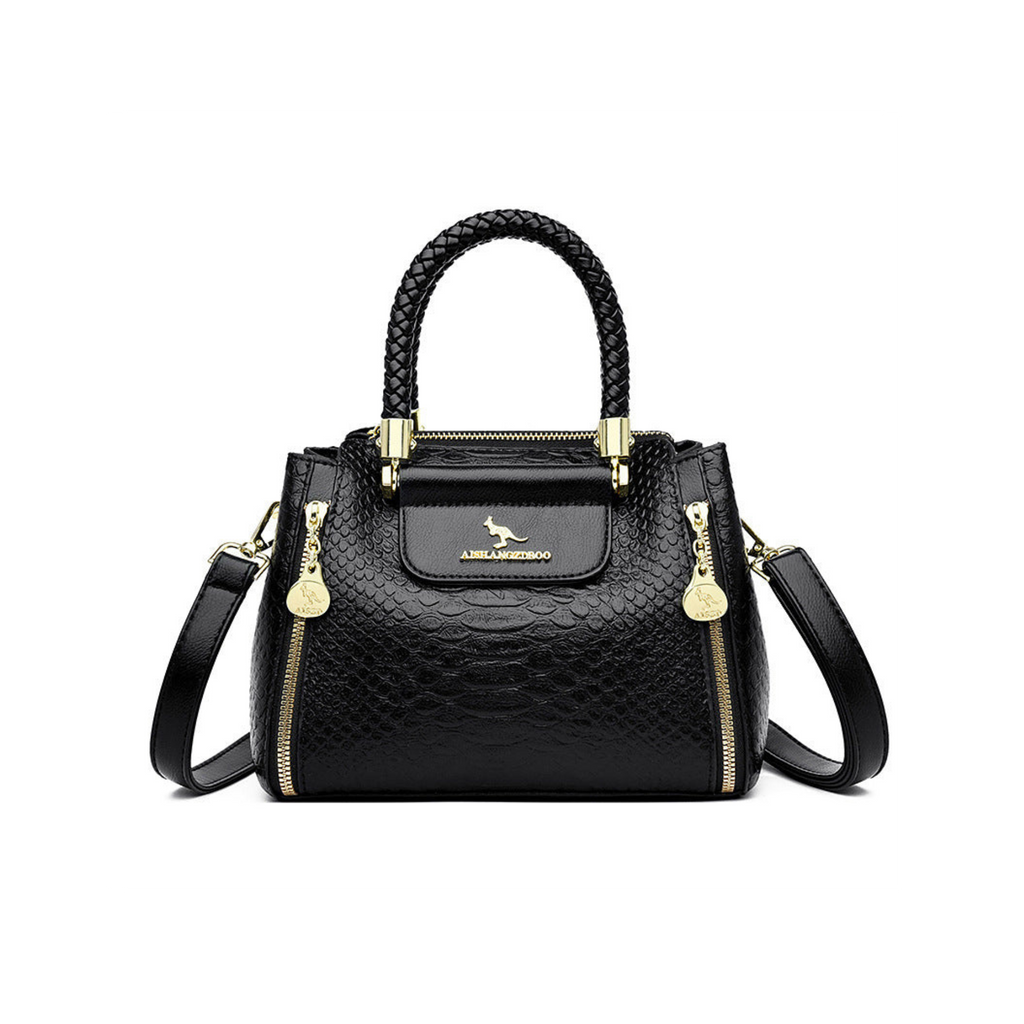 Black handbag with gold accents on a white background