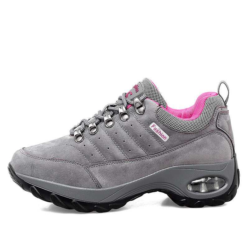 Gray sneaker with pink lining on a white background