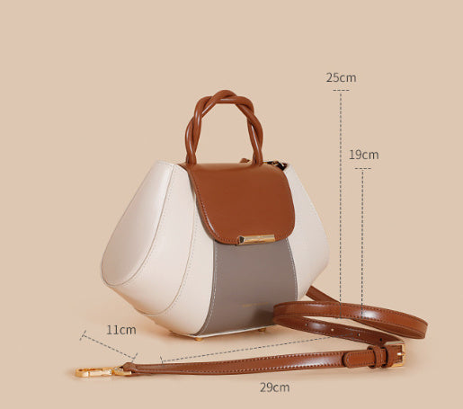 White handbag with brown accents and measurements on a beige background