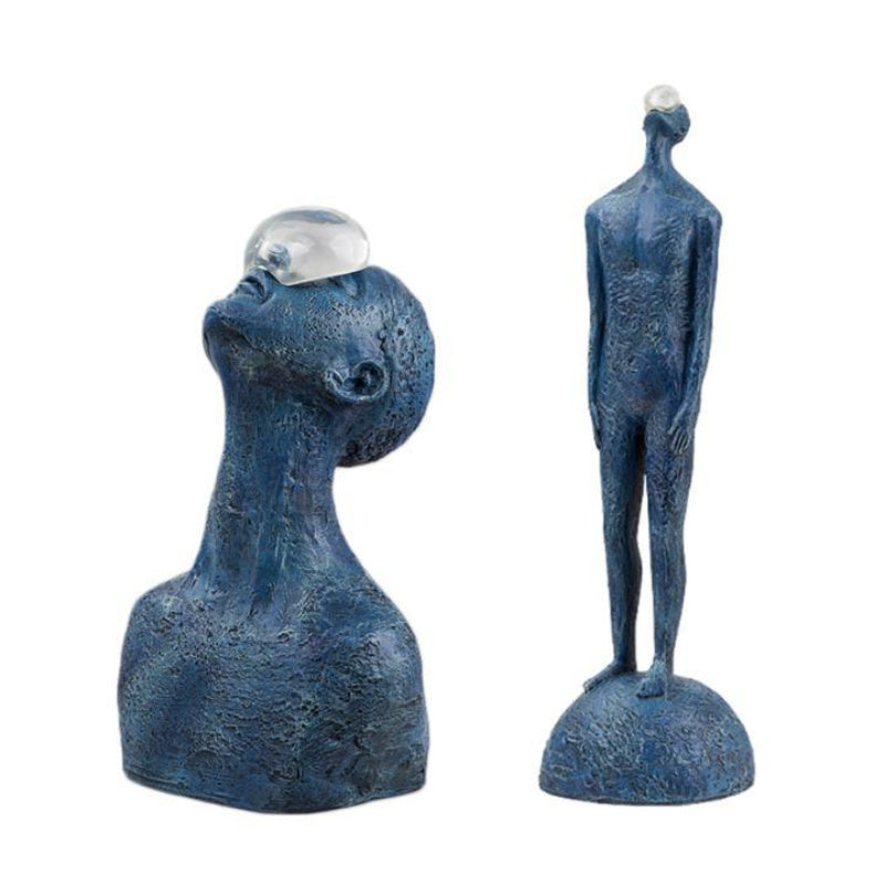 Two blue abstract sculptures on a white background