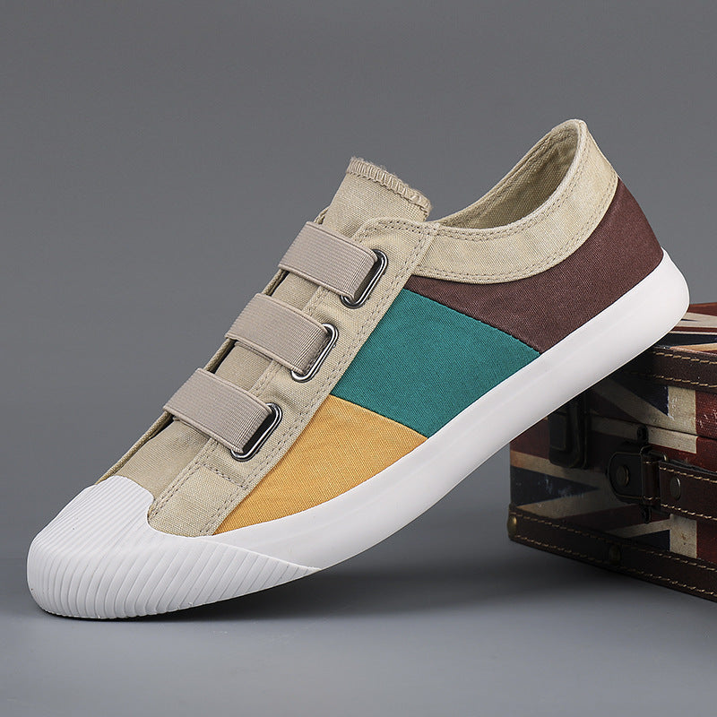 Multicolored sneaker with velcro straps on a gray background