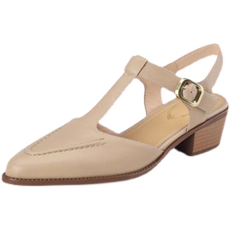 Beige sandal with a buckle on a white background