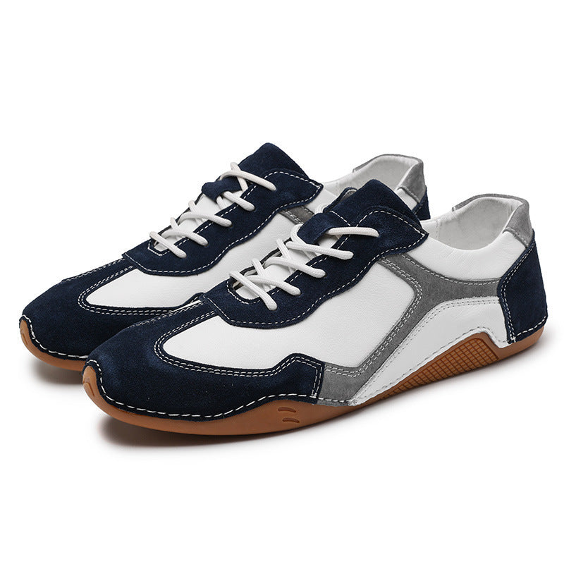 Navy and white sneakers with brown soles on a white background