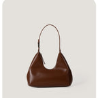 Brown handbag on a light gray background