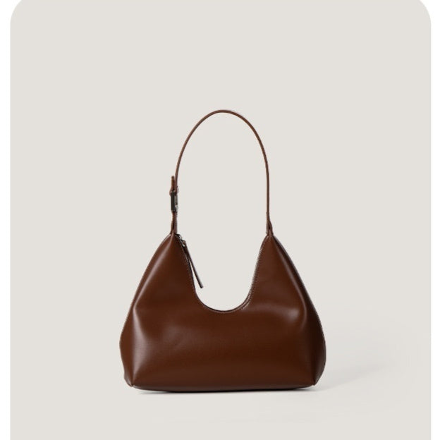 Brown handbag on a light gray background