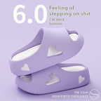 Purple slide sandals with heart designs on a light purple background