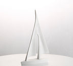 White sailboat model on a white background
