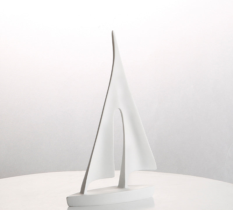 White sailboat model on a white background