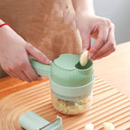 Person using a green garlic press on a wooden surface