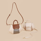 Two handbags, one with a brown strap and another with a detachable strap, on a beige background.