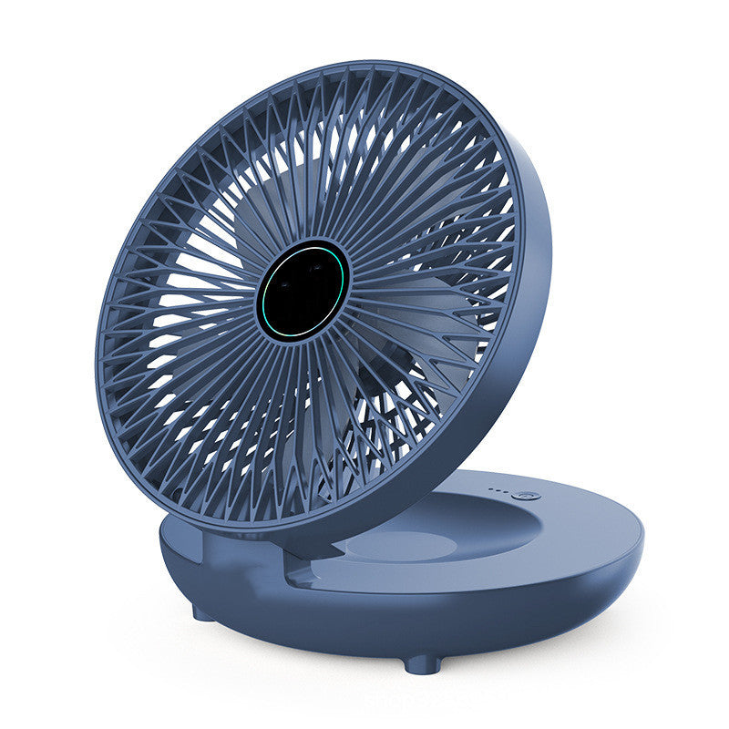Blue portable fan on a white background