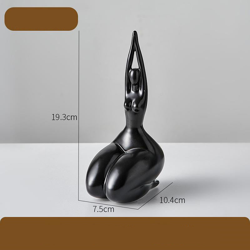 Black abstract sculpture on a gray background with measurements indicated.