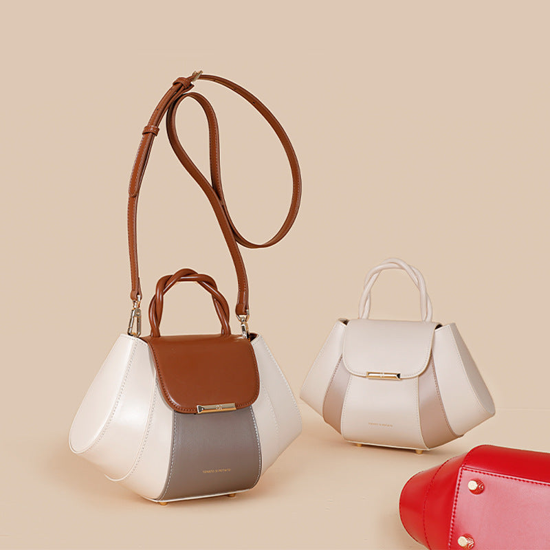 Two handbags, one white with brown accents and the other red, on a beige background.