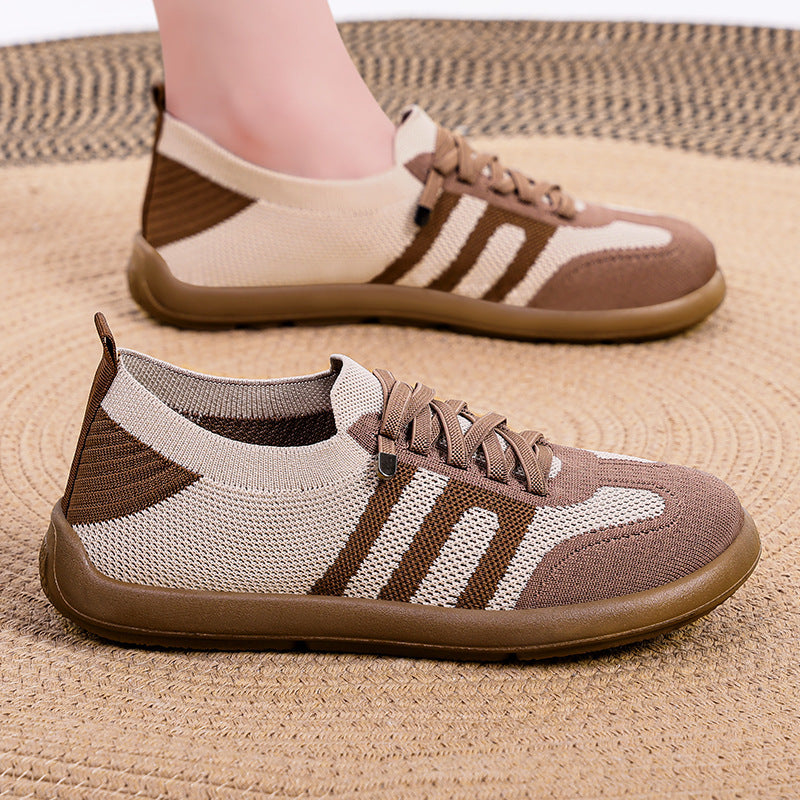 Brown and beige sneakers on a textured surface