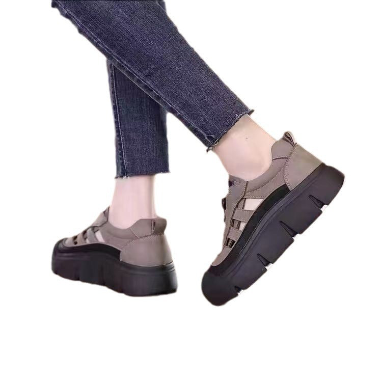 Gray platform shoes worn with jeans on a white background