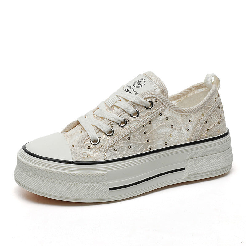 White sneaker with lace details on a white background