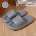 Gray slides on a wooden surface with a motivational book in the background