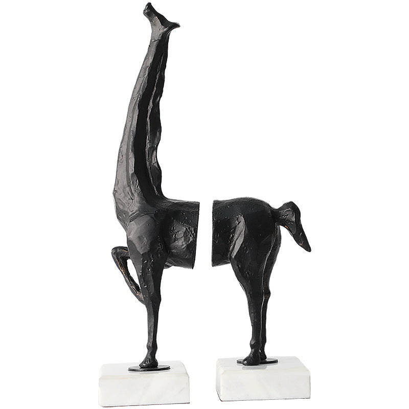 Black abstract sculpture on a white background