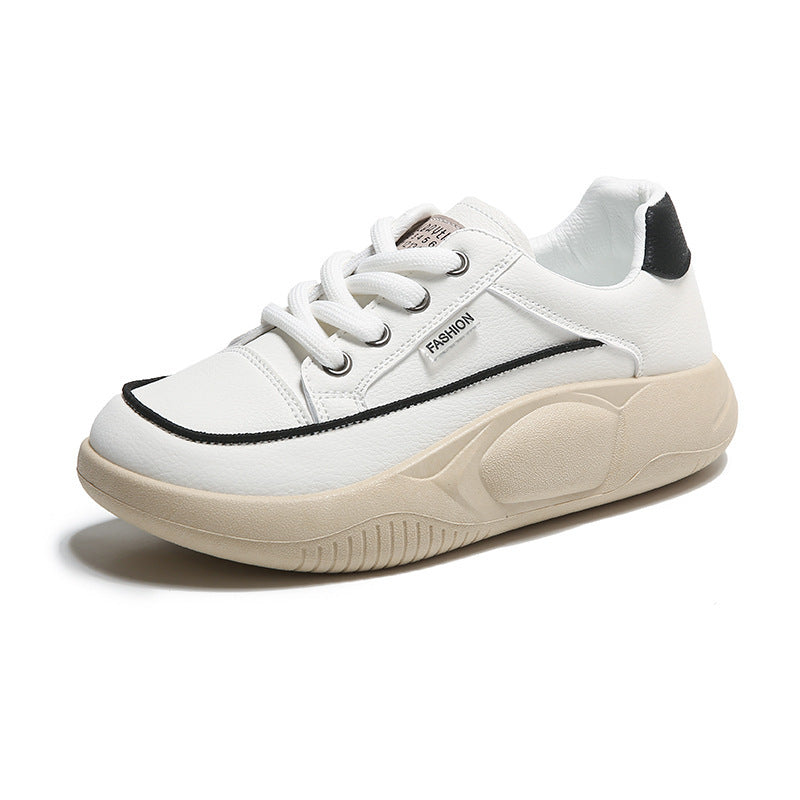 White sneaker with black accents on a white background