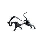 Black abstract sculpture of a cat on a white background