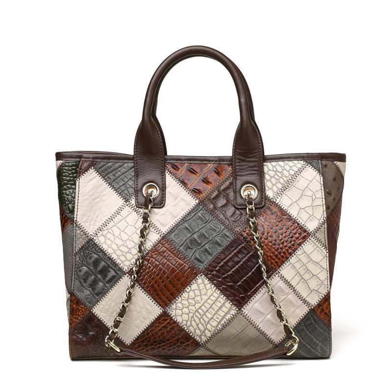 Patchwork handbag with brown, gray, and beige pattern on a white background