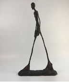 Abstract sculpture of a human figure on a white background