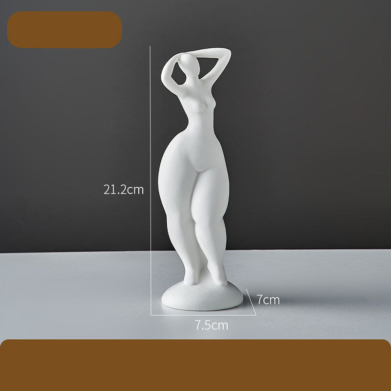 White abstract sculpture on a gray surface with measurements indicated.